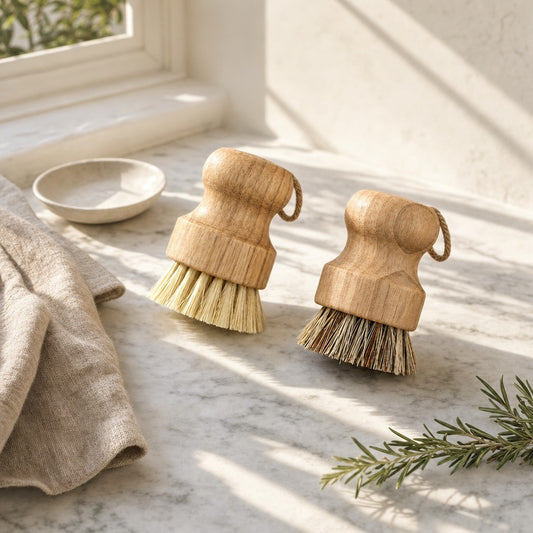 Natural pot brushes on a sunlit marble counter